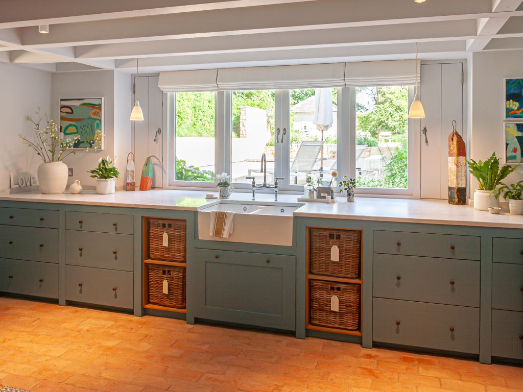 kitchen with belfast sink and wicker baskets
